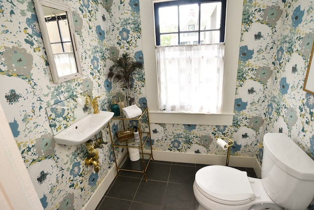 420 Randolph Ave, Cape Charles, VA 23310 - bathroom featuring baseboards, toilet, tile patterned floors, and wallpapered walls