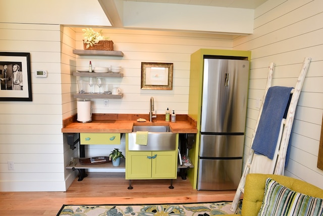 420 Randolph Ave, Cape Charles, VA 23310 - kitchen featuring green cabinets, freestanding refrigerator, wooden walls, wooden counters, and open shelves