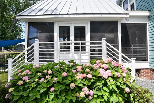 420 Randolph Ave, Cape Charles, VA 23310 - view of side of home with a standing seam roof, a sunroom, and metal roof