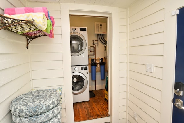 420 Randolph Ave, Cape Charles, VA 23310 - washroom with stacked washer / dryer and wood finished floors