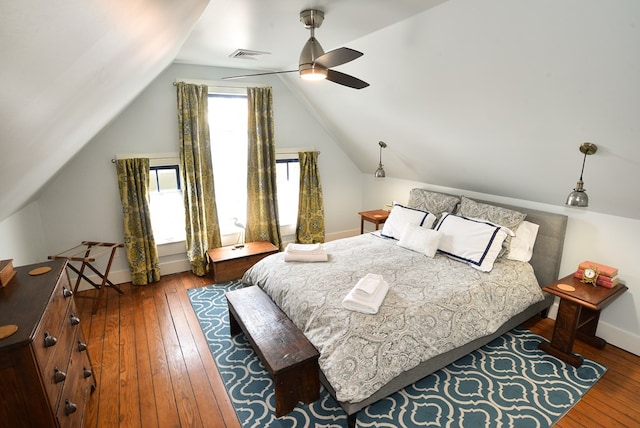 420 Randolph Ave, Cape Charles, VA 23310 - bedroom with wood-type flooring, vaulted ceiling, baseboards, and a ceiling fan