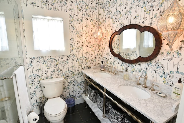 420 Randolph Ave, Cape Charles, VA 23310 - bathroom featuring wallpapered walls, double vanity, tile patterned floors, toilet, and radiator