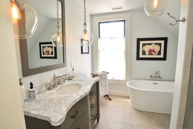 420 Randolph Ave, Cape Charles, VA 23310 - bathroom with vanity, a soaking tub, healthy amount of natural light, tile patterned floors, and vaulted ceiling