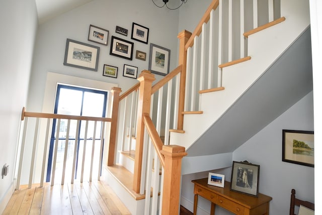 420 Randolph Ave, Cape Charles, VA 23310 - stairs featuring vaulted ceiling, hardwood / wood-style flooring, and baseboards