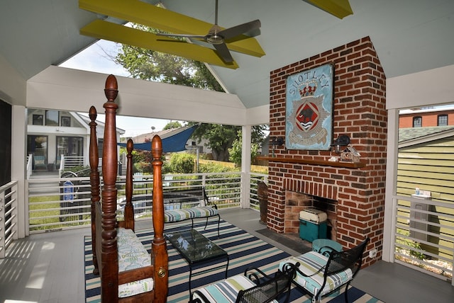 420 Randolph Ave, Cape Charles, VA 23310 - porch featuring an outdoor brick fireplace and a ceiling fan