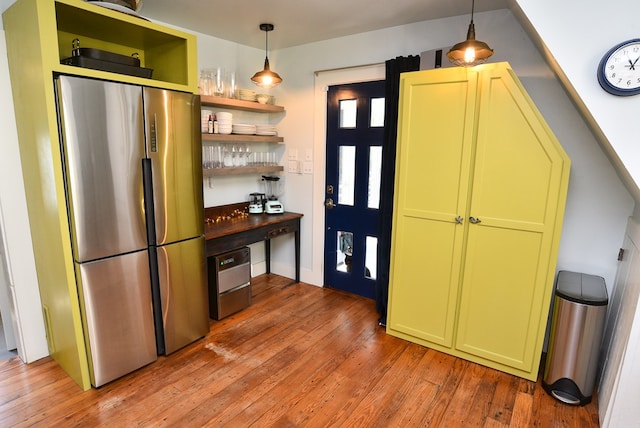 420 Randolph Ave, Cape Charles, VA 23310 - kitchen with freestanding refrigerator, green cabinets, open shelves, and light wood-style floors