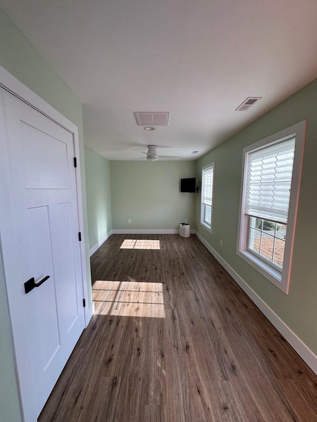 interior space featuring dark hardwood / wood-style floors and ceiling fan