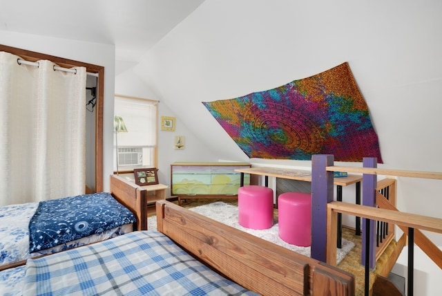 bedroom with cooling unit and lofted ceiling