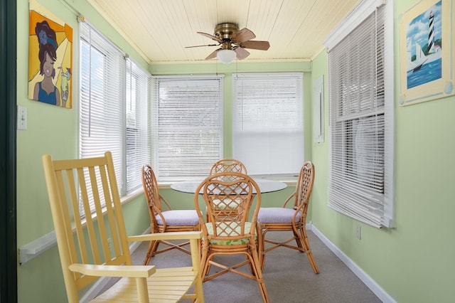 sunroom / solarium featuring ceiling fan