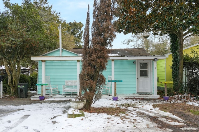 view of snow covered house