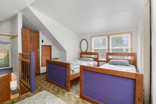 carpeted bedroom featuring vaulted ceiling