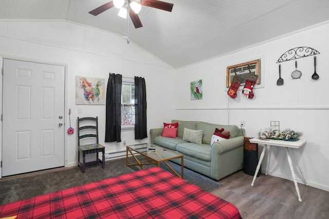 living room with hardwood / wood-style floors, vaulted ceiling, and ceiling fan