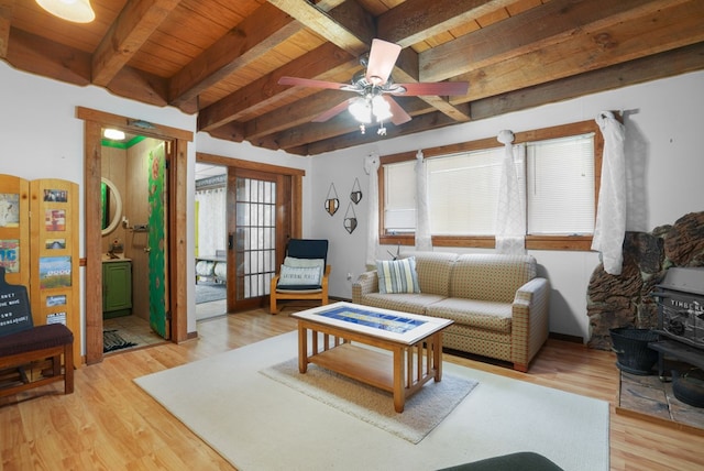 living room with beamed ceiling, light hardwood / wood-style flooring, ceiling fan, and wood ceiling