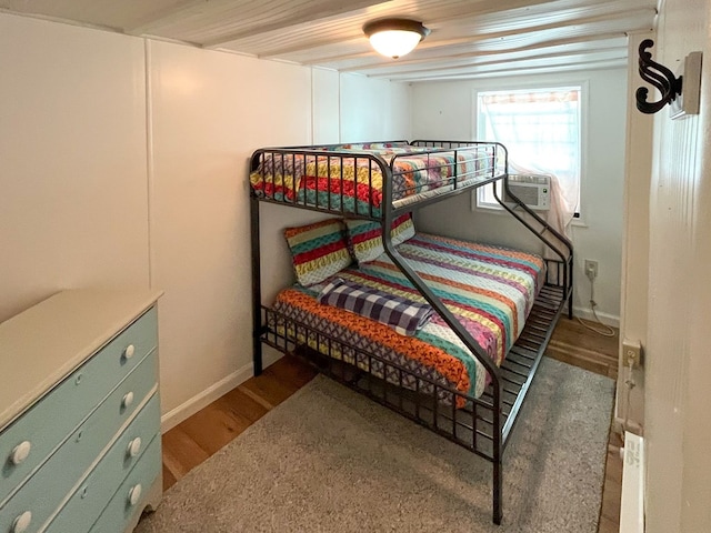 bedroom with wood-type flooring