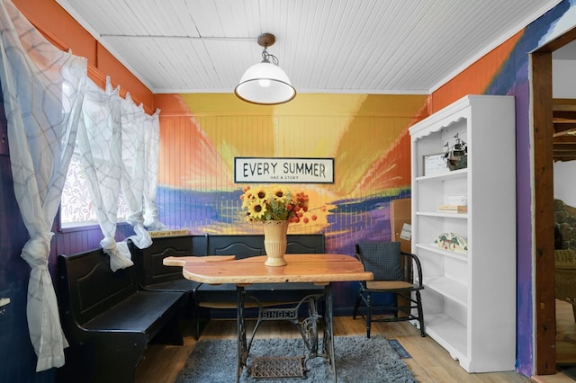 dining area with hardwood / wood-style flooring, breakfast area, and ornamental molding