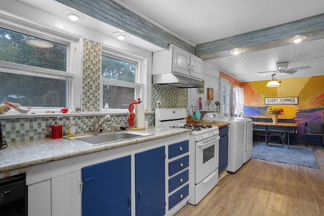 kitchen with backsplash, white gas range, sink, light hardwood / wood-style flooring, and white cabinets