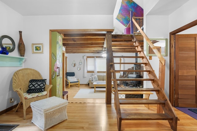 stairs with hardwood / wood-style flooring