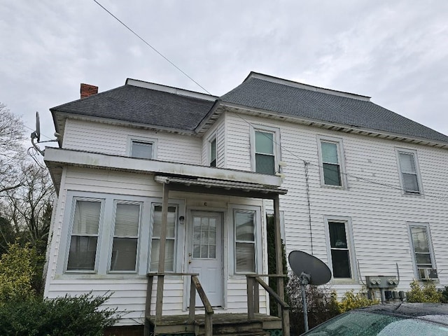 view of front of house with cooling unit