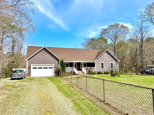 17481 Mitchell Ln, Parksley, VA 23421 - ranch-style house with driveway, a fenced front yard, a front lawn, covered porch, and a garage