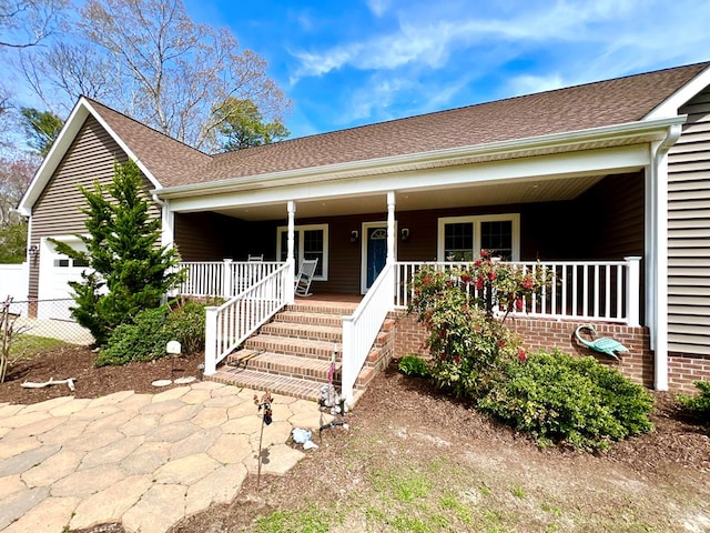 17481 Mitchell Ln, Parksley, VA 23421 - ranch-style home featuring an attached garage, fence, and a porch