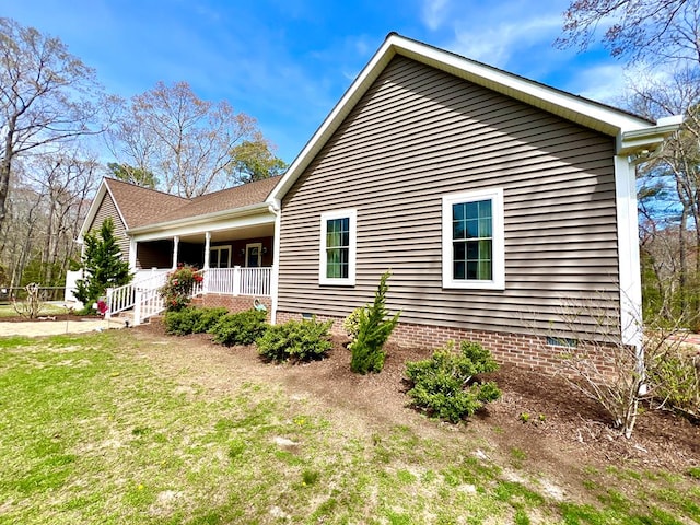 17481 Mitchell Ln, Parksley, VA 23421 - view of home's exterior with a lawn, crawl space, and a porch