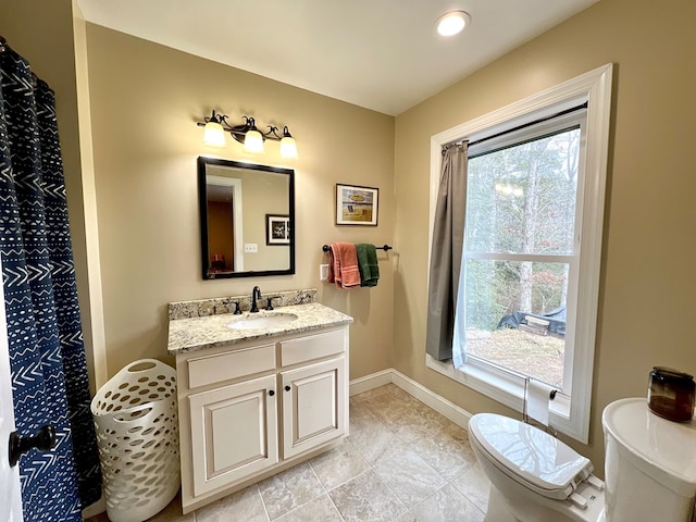 17481 Mitchell Ln, Parksley, VA 23421 - bathroom with baseboards, toilet, and vanity