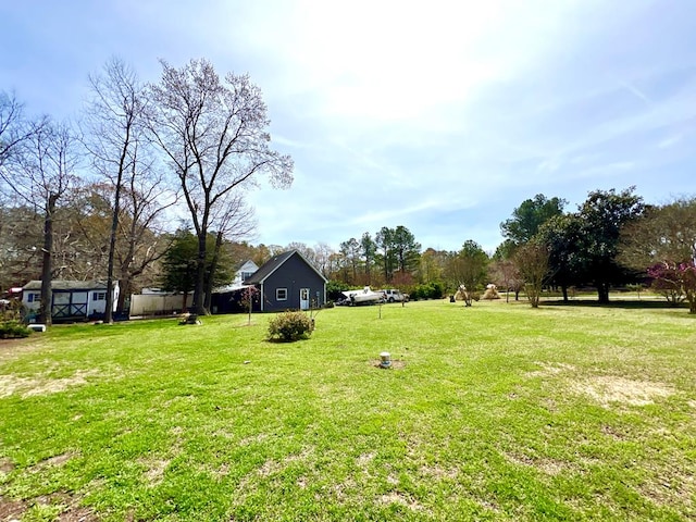 17481 Mitchell Ln, Parksley, VA 23421 - view of yard with a storage unit and an outbuilding