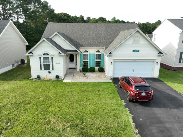37275 Longboat Ct, Greenbackville, VA 23356 - view of front of home featuring asphalt driveway, an attached garage, roof with shingles, and a front yard