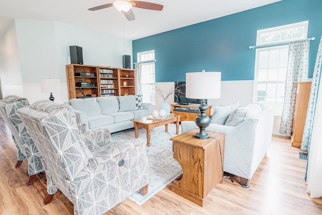 37275 Longboat Ct, Greenbackville, VA 23356 - living area featuring a wainscoted wall, light wood-style flooring, and a ceiling fan