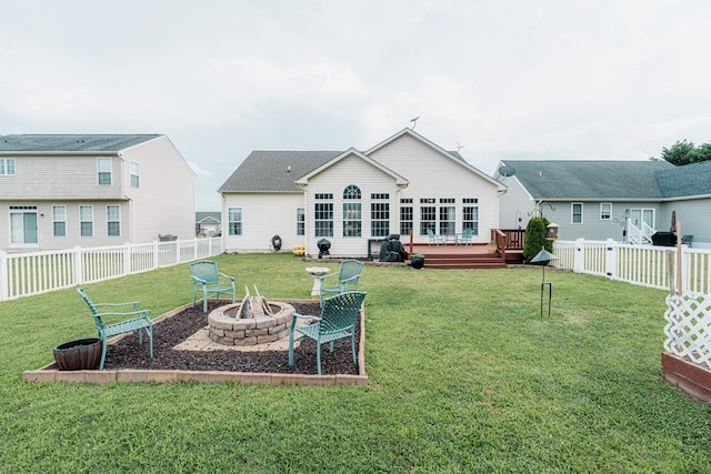 37275 Longboat Ct, Greenbackville, VA 23356 - back of house featuring an outdoor fire pit, a deck, and a fenced backyard