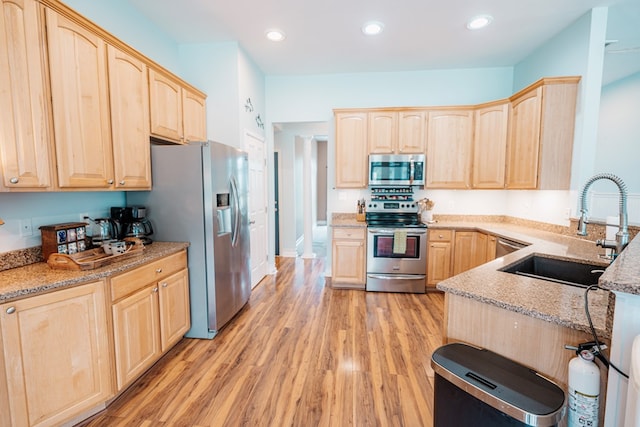 37275 Longboat Ct, Greenbackville, VA 23356 - kitchen featuring light brown cabinetry, stainless steel appliances, light stone countertops, light wood-type flooring, and recessed lighting