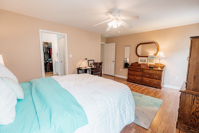 37275 Longboat Ct, Greenbackville, VA 23356 - bedroom featuring wood finished floors, ceiling fan, a walk in closet, and a closet