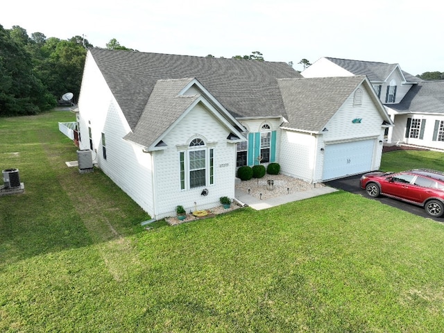 37275 Longboat Ct, Greenbackville, VA 23356 - view of front facade featuring driveway, a garage, a front lawn, and roof with shingles