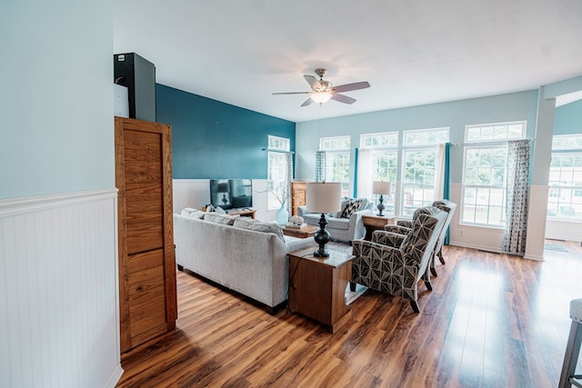 37275 Longboat Ct, Greenbackville, VA 23356 - living area featuring a ceiling fan, wood finished floors, and a wainscoted wall