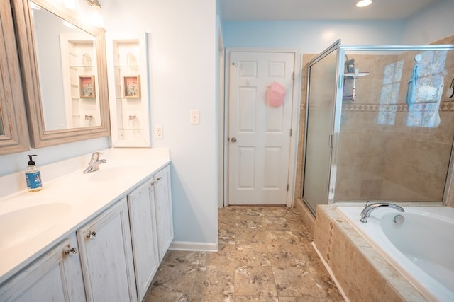 37275 Longboat Ct, Greenbackville, VA 23356 - bathroom featuring double vanity, a stall shower, a garden tub, stone finish flooring, and recessed lighting
