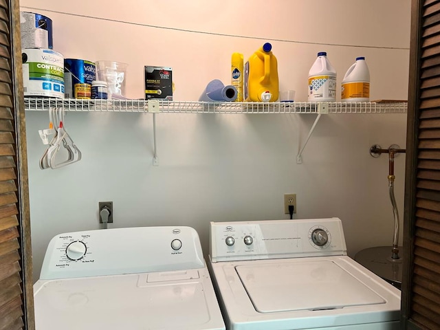 laundry area with laundry area and washer and clothes dryer