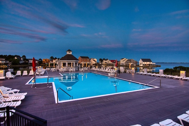 pool at dusk with a water view