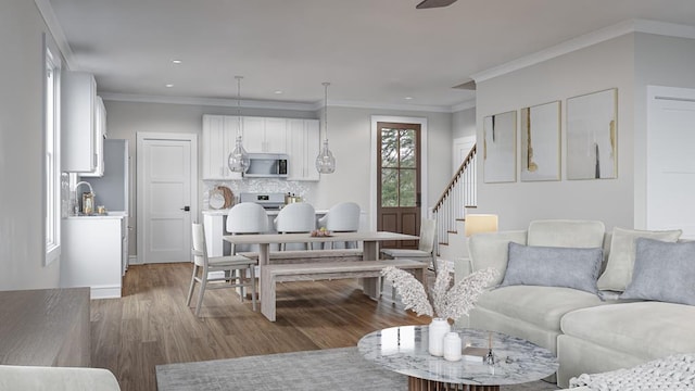 living room with wood-type flooring and crown molding