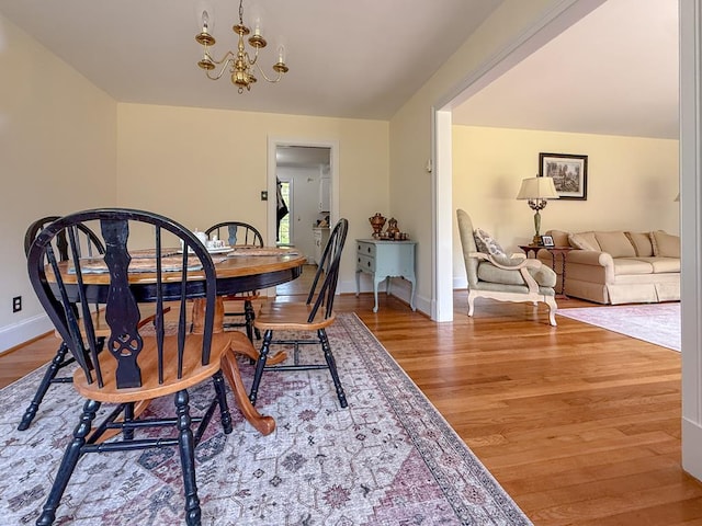 35197 Hillsborough Dr, Belle Haven, VA 23306 - dining space featuring wood finished floors, a chandelier, and baseboards
