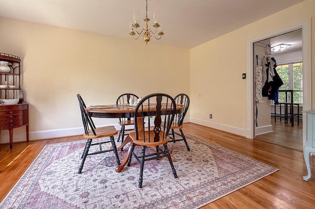 35197 Hillsborough Dr, Belle Haven, VA 23306 - dining area featuring baseboards, wood finished floors, and a chandelier