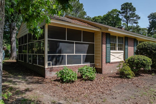 35197 Hillsborough Dr, Belle Haven, VA 23306 - view of side of home featuring brick siding and a sunroom