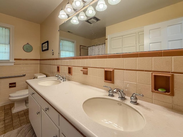 35197 Hillsborough Dr, Belle Haven, VA 23306 - full bathroom featuring toilet, tile patterned floors, tile walls, a shower with curtain, and double vanity