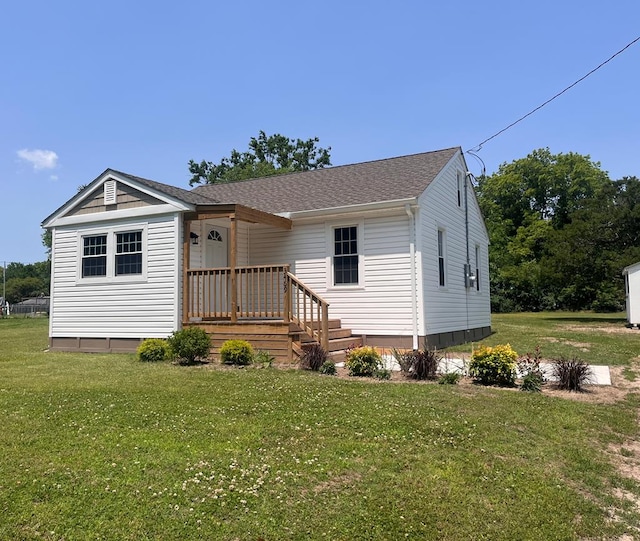 3469 Willis Wharf Rd, Exmore, VA 23350 - manufactured / mobile home with a front lawn and roof with shingles