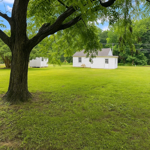 3469 Willis Wharf Rd, Exmore, VA 23350 - view of grassy yard with an outbuilding