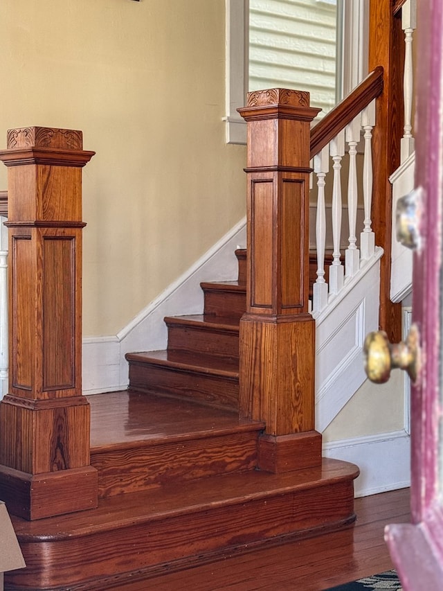 staircase featuring wood finished floors