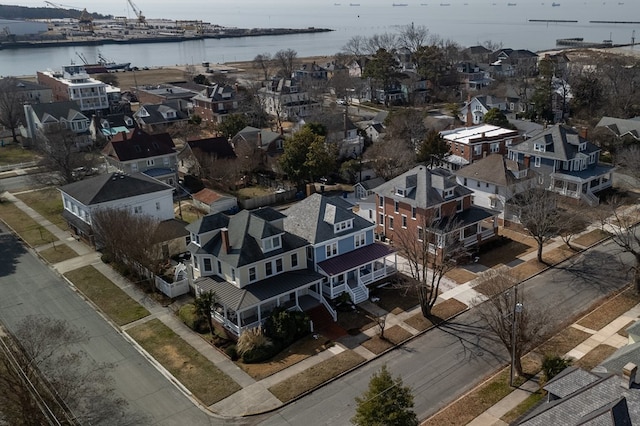 bird's eye view with a water view and a residential view