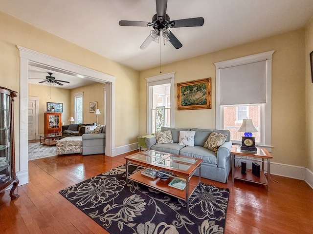 living room featuring plenty of natural light, hardwood / wood-style flooring, and baseboards