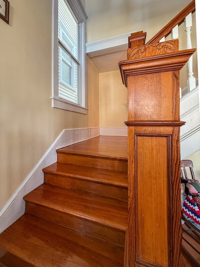 stairway featuring baseboards