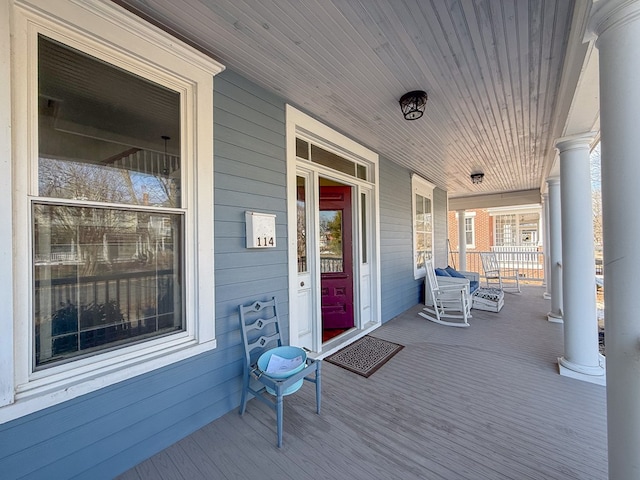 wooden terrace with a porch