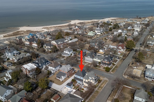 bird's eye view featuring a residential view and a water view